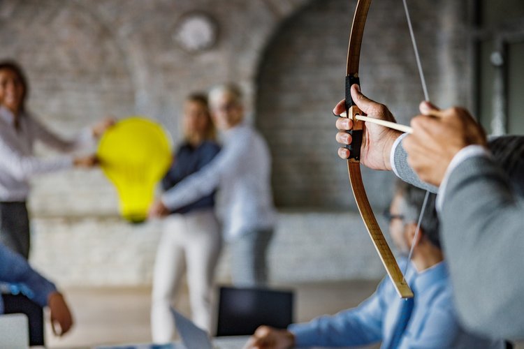 Thought leadership marketing for companies that sell a process - AI image of a lady standing looking toward a wall covered in complicated artwork and processes.